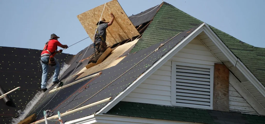 Two experts are diligently working on the roof, delivering exceptional Roof Replacement Services in Round Rock, TX .