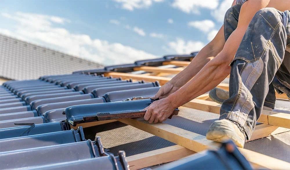 A man is working for shingle roof repair in Manor, TX