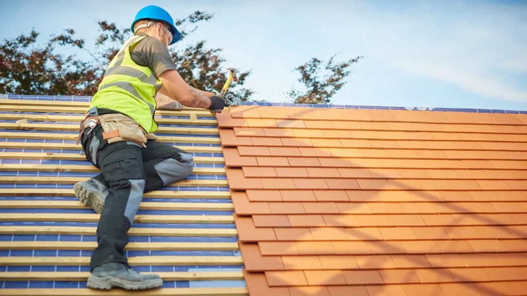 A man is working for shingle roof installation service in Austin, TX