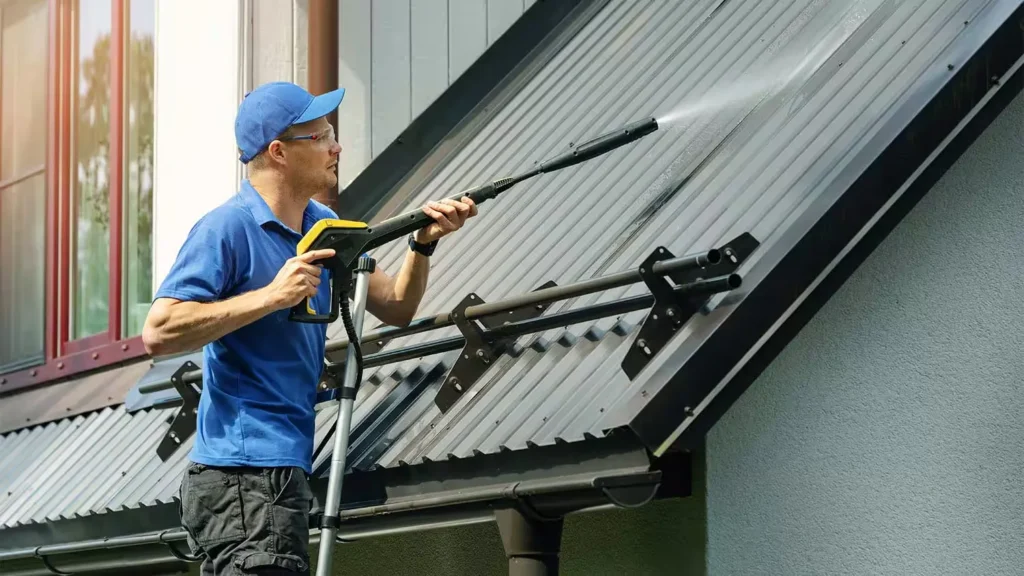 A handyman is cleaning the roof in Austin, TX