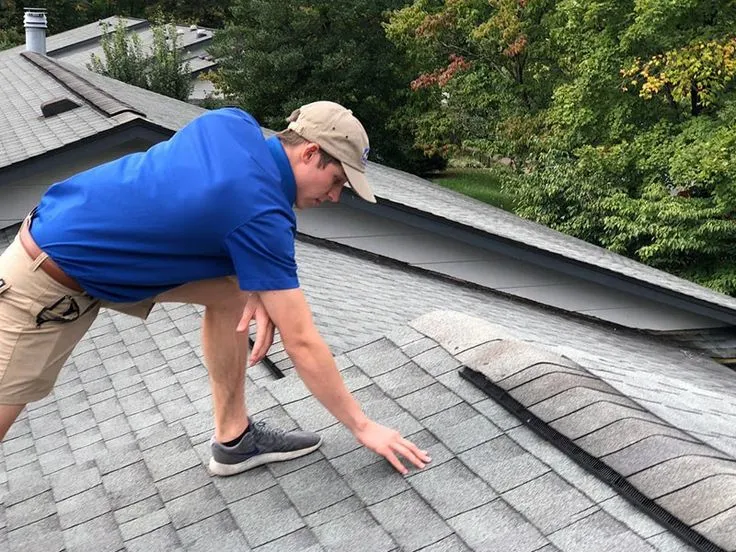 A professional is inspecting the roof for Shingle Roof Repair Services in Manor, TX