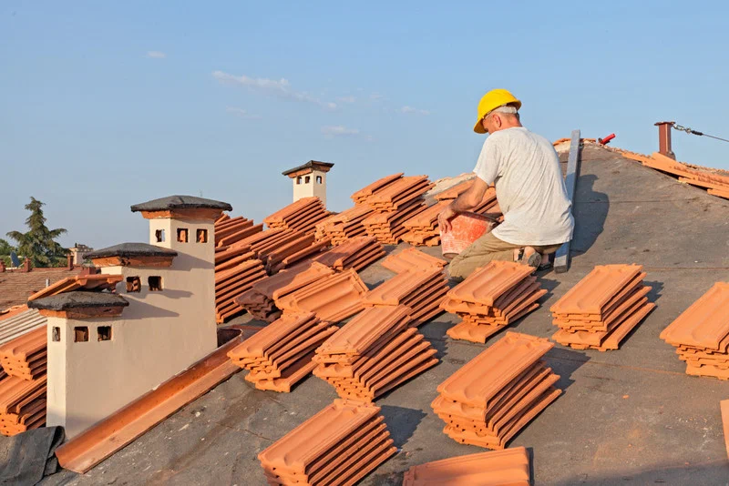 A skilled man is installing roof in Leander, TX