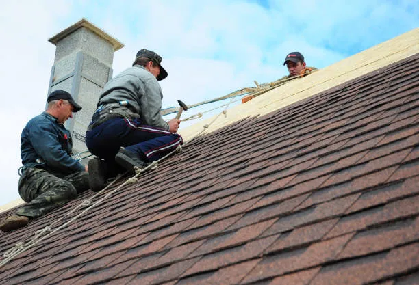 Two skilled person doing Roof Repair Services in Hutto, TX