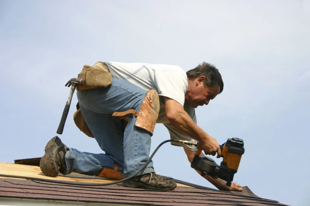 A professional roofer is repairing roof in Leander, TX