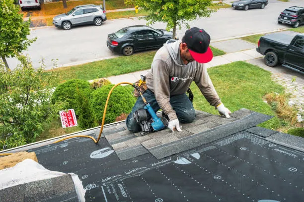 A skilled handyman is doing shingle roof repair services in Taylor, TX.